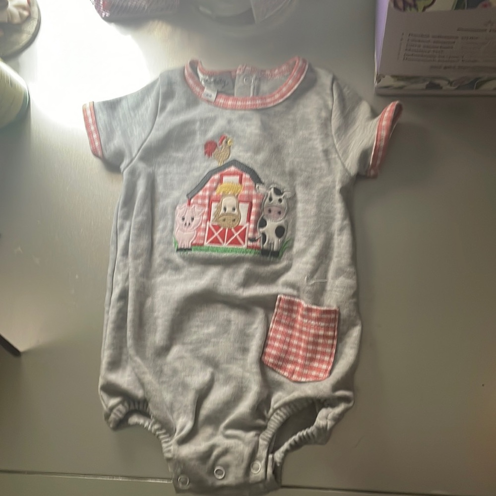 Magnolia baby newborn onesie